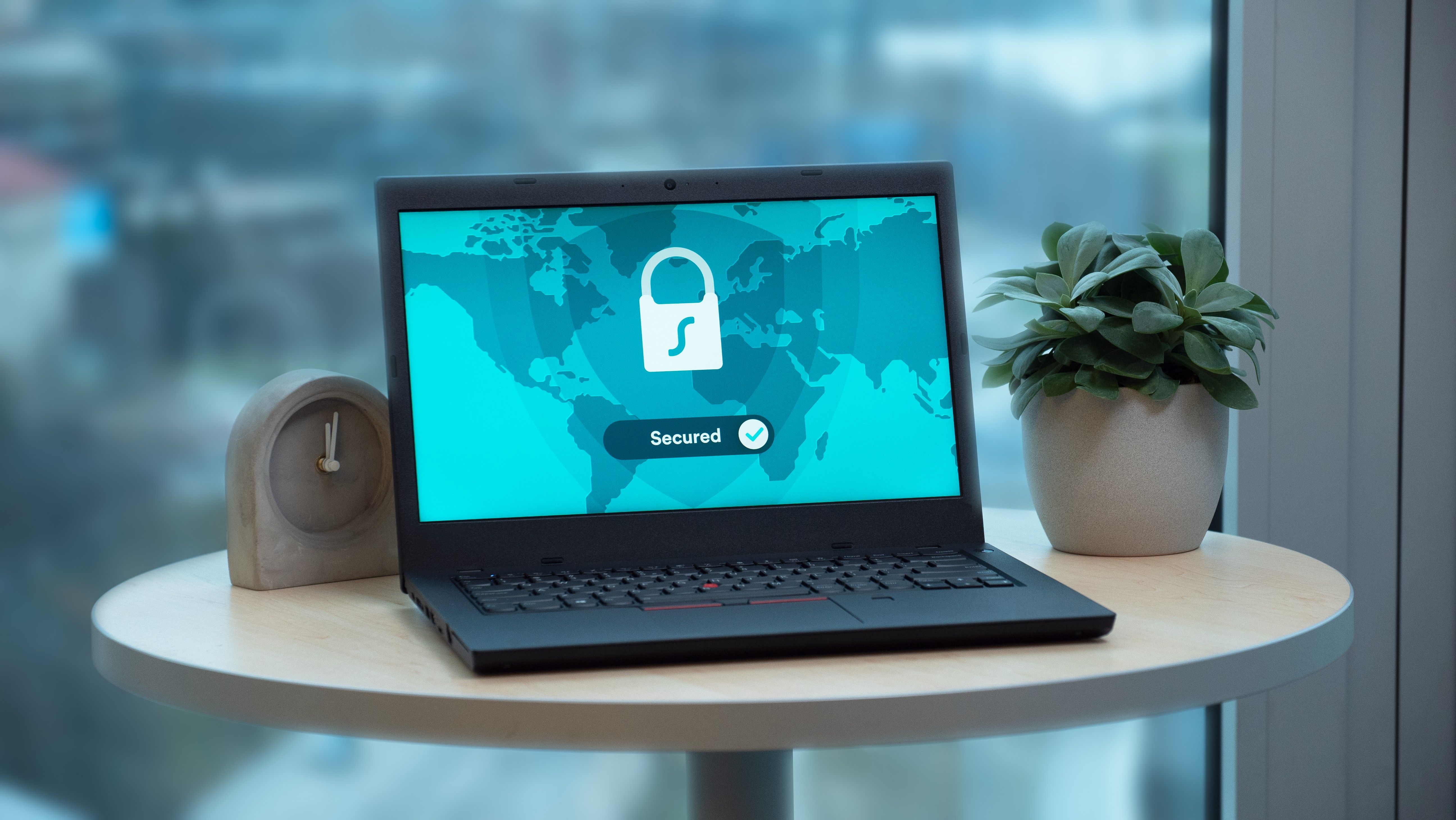 A laptop displaying a security lock icon, representing protected accounts and confidential data.